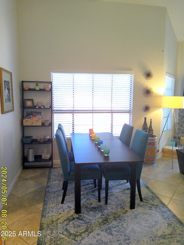 8700 E Mountain View Rd Unit 2029, Scottsdale, AZ 85258 - dining space with light tile patterned floors and baseboards