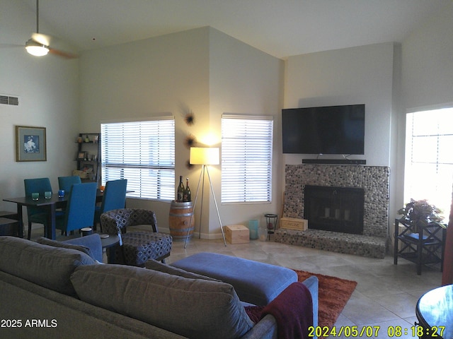 8700 E Mountain View Rd Unit 2029, Scottsdale, AZ 85258 - tiled living area featuring a fireplace with raised hearth and a ceiling fan