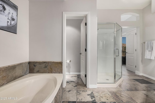 7887 N 16th St Unit 224, Phoenix, AZ 85020 - full bathroom featuring a stall shower and a garden tub