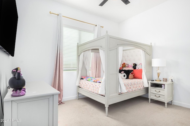 bedroom with ceiling fan and light carpet