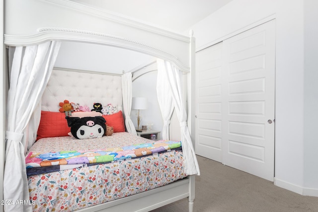 carpeted bedroom with a closet