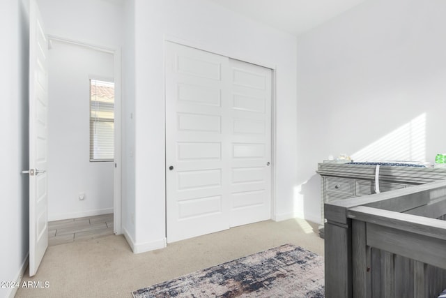 carpeted bedroom featuring a closet