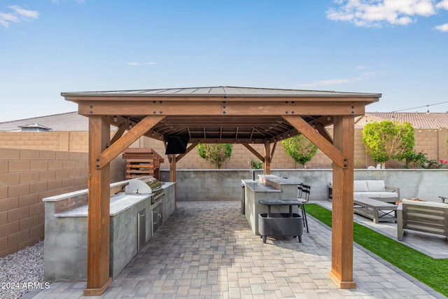 view of patio with a gazebo, a grill, area for grilling, and outdoor lounge area