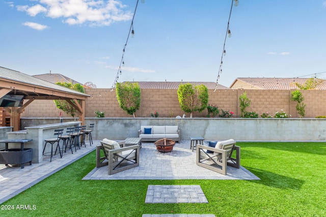 view of patio featuring a gazebo, exterior bar, and an outdoor living space with a fire pit