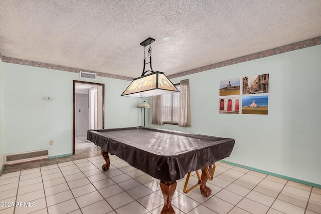 playroom with light tile patterned floors, a textured ceiling, and pool table