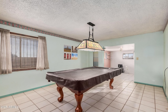 playroom featuring light tile patterned floors, a textured ceiling, and pool table