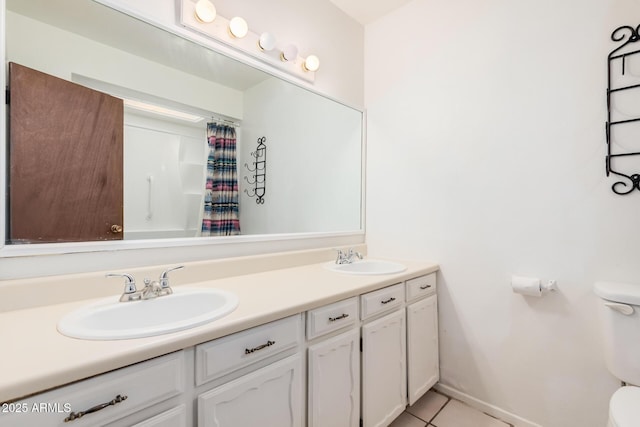 bathroom with a shower with curtain, tile patterned flooring, vanity, and toilet