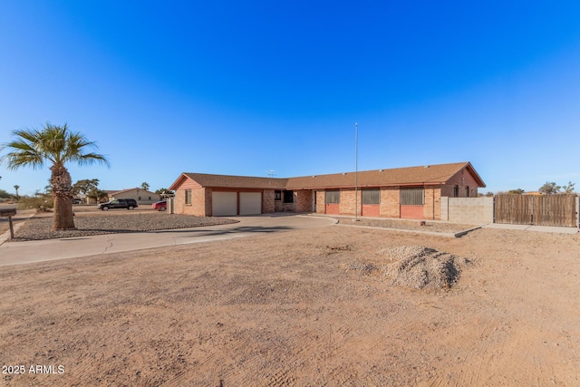 single story home featuring a garage