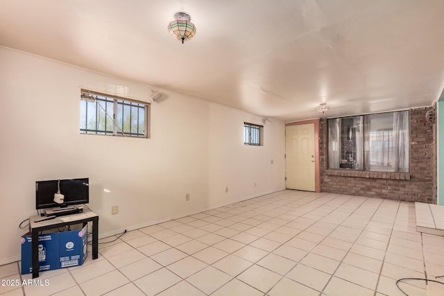 unfurnished living room with light tile patterned flooring