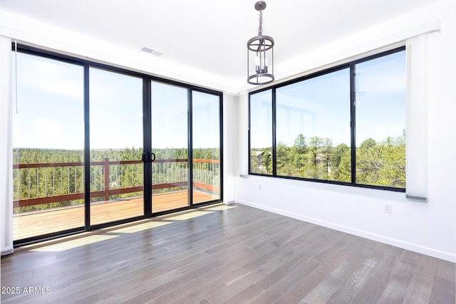 2943 E Lookout Ln, Overgaard, AZ 85933 - unfurnished room featuring baseboards and wood finished floors