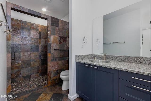 2943 E Lookout Ln, Overgaard, AZ 85933 - full bath with walk in shower, toilet, stone finish floors, and vanity