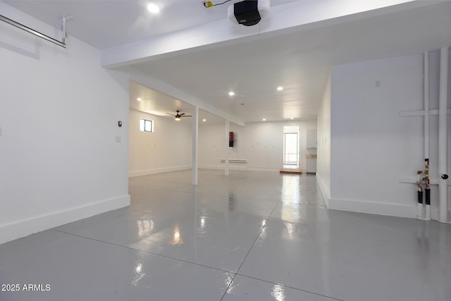 2943 E Lookout Ln, Overgaard, AZ 85933 - garage with recessed lighting, a garage door opener, ceiling fan, baseboards, and a baseboard heating unit