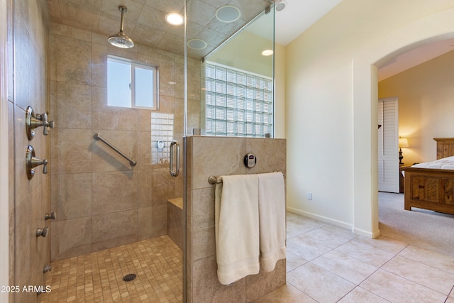 bathroom with tile patterned flooring and walk in shower