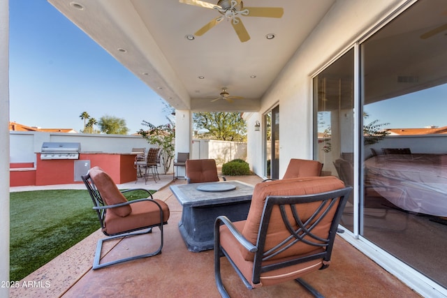 view of patio featuring ceiling fan and area for grilling