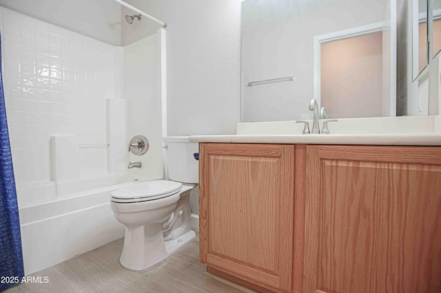 full bathroom featuring wood-type flooring, toilet, vanity, and shower / tub combo with curtain