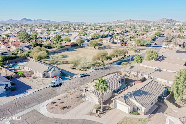 birds eye view of property with a mountain view