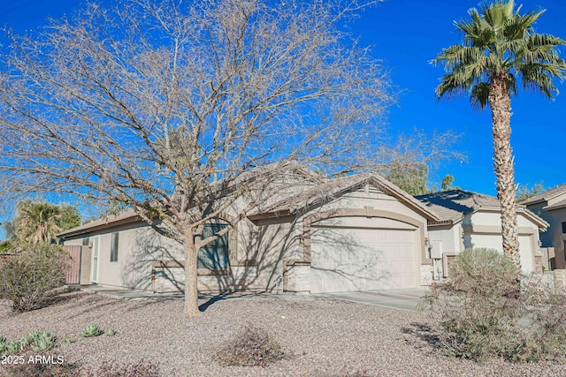 ranch-style home with a garage