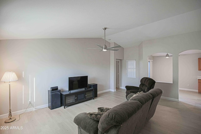 living room with light wood-type flooring, vaulted ceiling, and ceiling fan