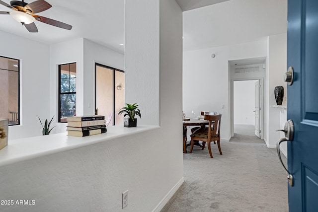 interior space featuring light carpet, visible vents, and baseboards