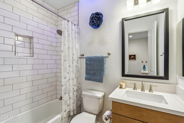 bathroom featuring vanity, toilet, and shower / tub combo