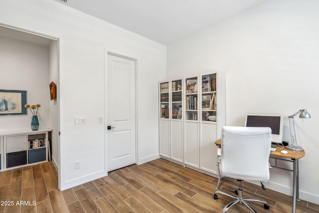 office with baseboards and wood finished floors