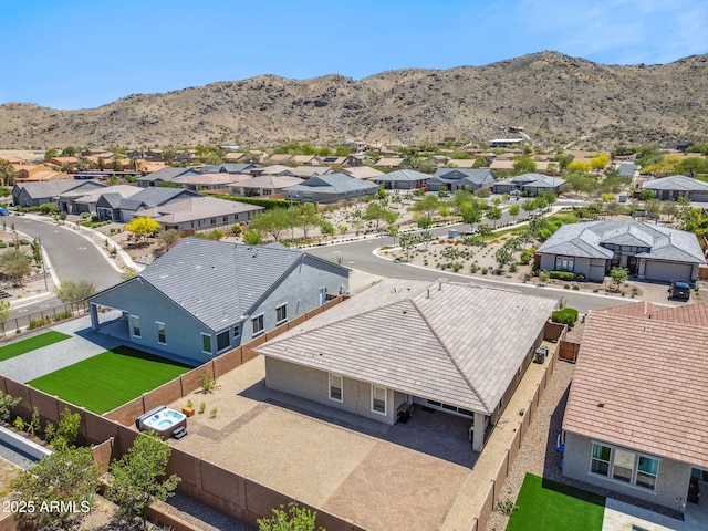 drone / aerial view with a residential view and a mountain view
