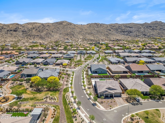 drone / aerial view featuring a residential view and a mountain view