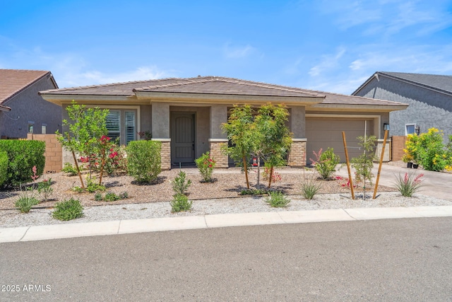 view of front of property featuring stucco siding, an attached garage, and driveway