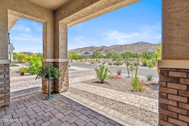 view of patio / terrace featuring a mountain view