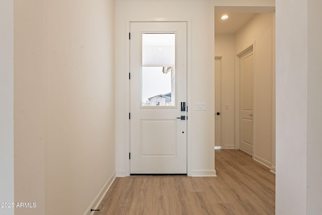 doorway to outside featuring light wood-type flooring