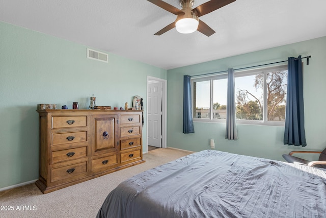 bedroom with light carpet and ceiling fan