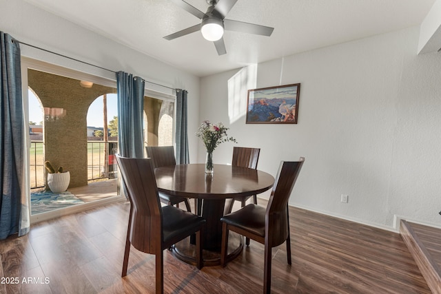 dining room with dark hardwood / wood-style floors and ceiling fan