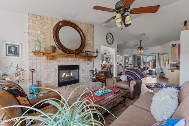 tiled living room with vaulted ceiling and a brick fireplace