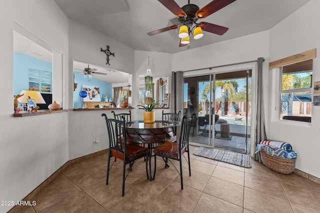 tiled dining area featuring ceiling fan