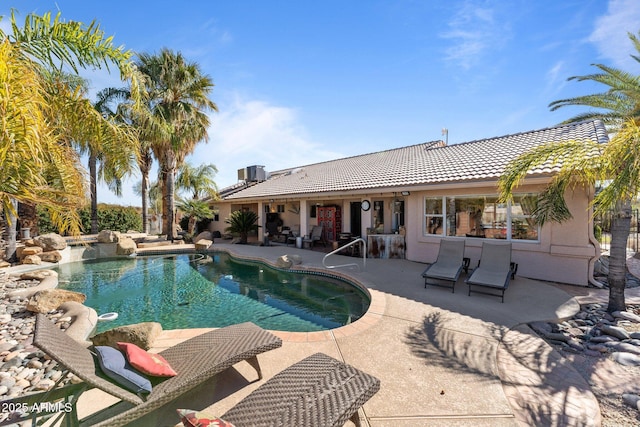 view of pool featuring a patio area