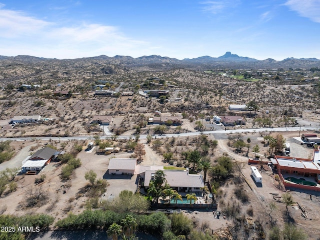 birds eye view of property featuring a mountain view