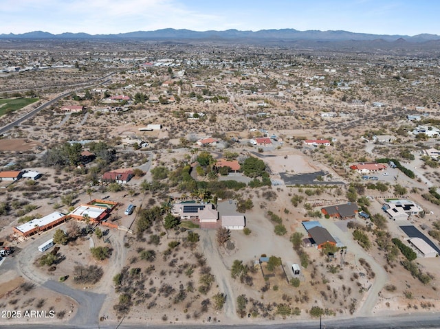 birds eye view of property with a mountain view