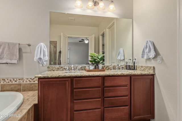 bathroom with ceiling fan, vanity, and plus walk in shower