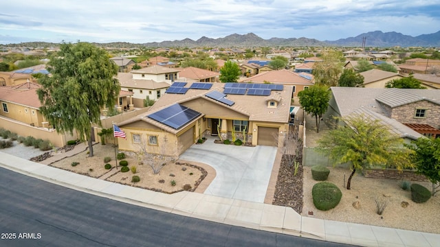 birds eye view of property with a mountain view