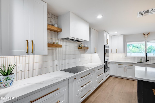 9005 W Villa Chula St, Peoria, AZ 85383 - kitchen with open shelves, black electric cooktop, a sink, decorative backsplash, and stainless steel double oven