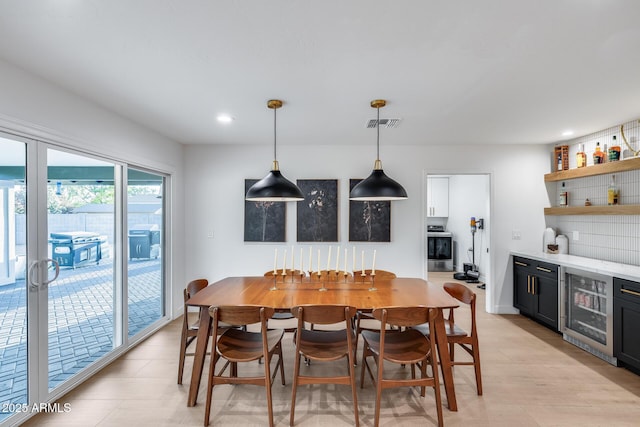 9005 W Villa Chula St, Peoria, AZ 85383 - dining space with beverage cooler, wet bar, and recessed lighting