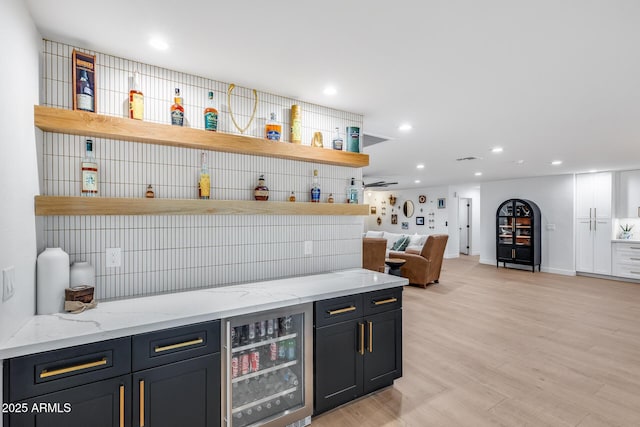 9005 W Villa Chula St, Peoria, AZ 85383 - bar area with wine cooler, light wood-style flooring, and recessed lighting