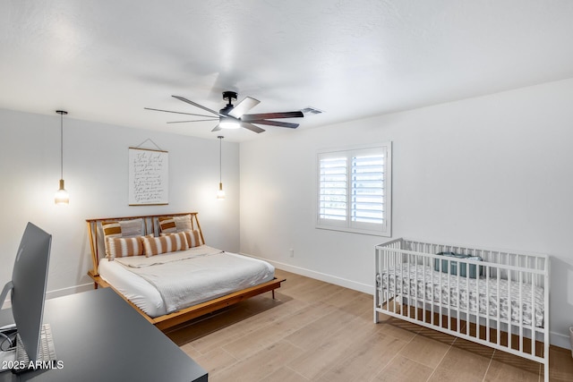 9005 W Villa Chula St, Peoria, AZ 85383 - bedroom with light wood finished floors, baseboards, and ceiling fan