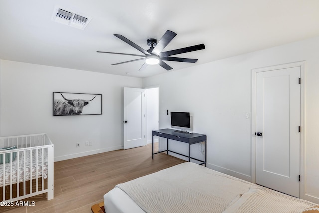 9005 W Villa Chula St, Peoria, AZ 85383 - bedroom with wood finished floors, baseboards, and ceiling fan