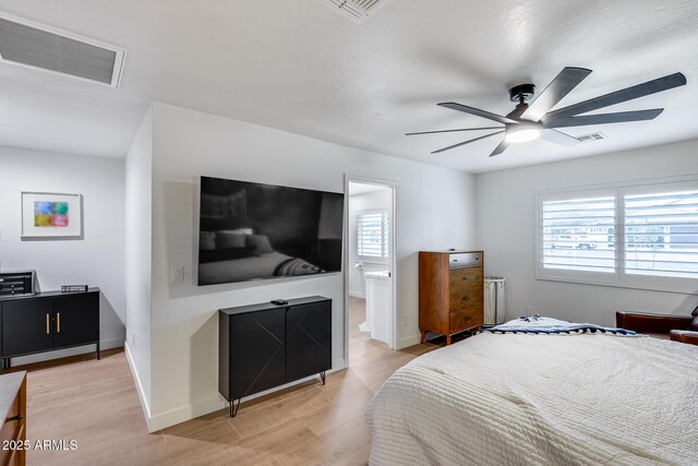 9005 W Villa Chula St, Peoria, AZ 85383 - bedroom with multiple windows, light wood-style flooring, a ceiling fan, and baseboards