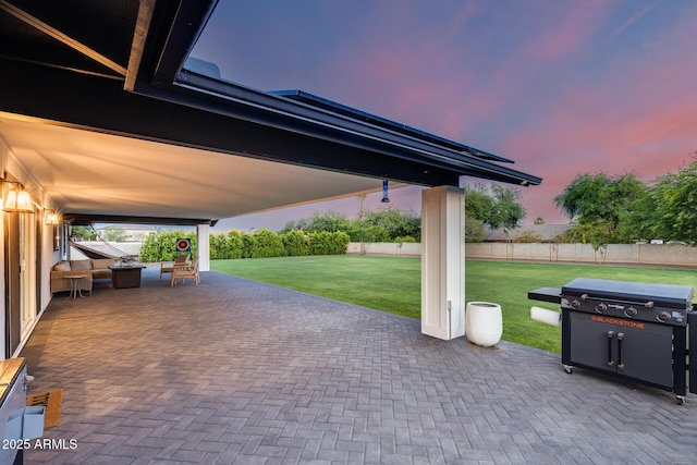 9005 W Villa Chula St, Peoria, AZ 85383 - patio terrace at dusk featuring a patio area