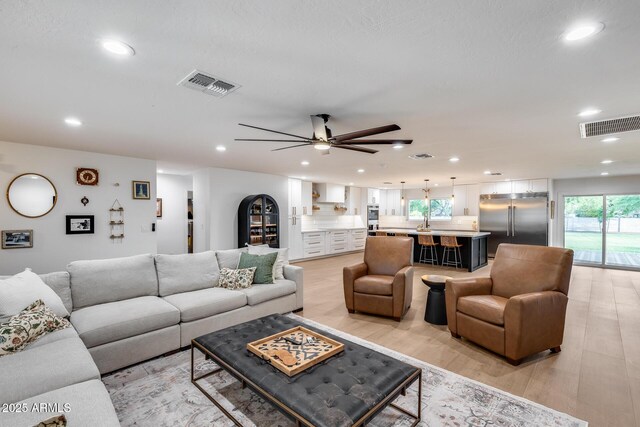 9005 W Villa Chula St, Peoria, AZ 85383 - living area featuring recessed lighting, ceiling fan, and light wood-type flooring