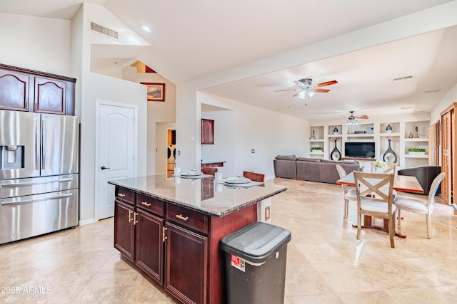 3597 W Mineral Butte Dr, San Tan Valley, AZ 85144 - kitchen featuring stainless steel fridge, ceiling fan, stone counters, a center island, and light tile patterned flooring
