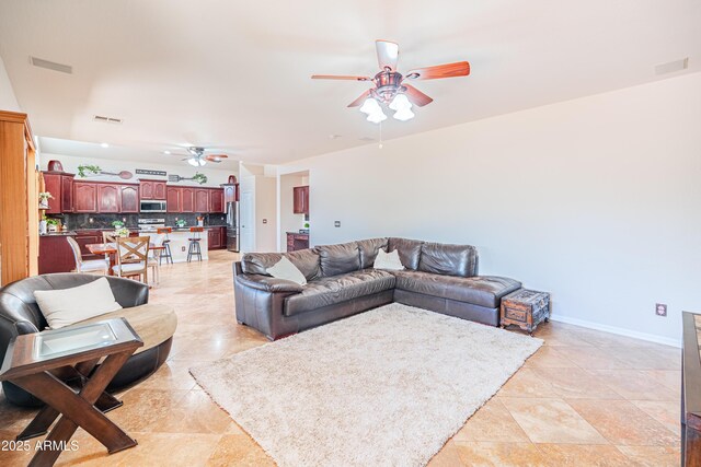 3597 W Mineral Butte Dr, San Tan Valley, AZ 85144 - living room with ceiling fan and baseboards