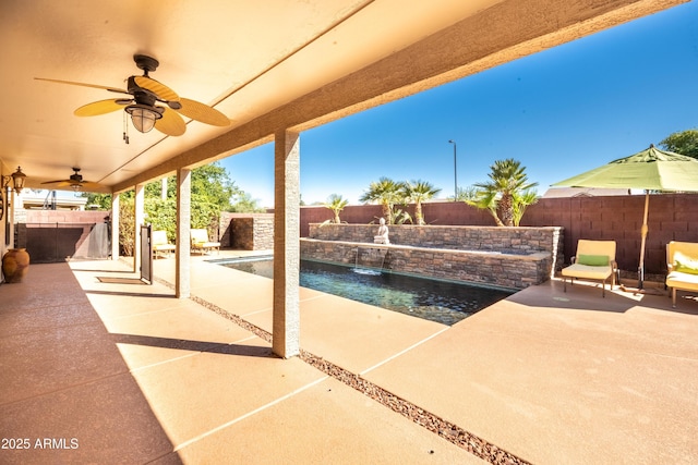 3597 W Mineral Butte Dr, San Tan Valley, AZ 85144 - fenced backyard featuring a patio, ceiling fan, and exterior kitchen